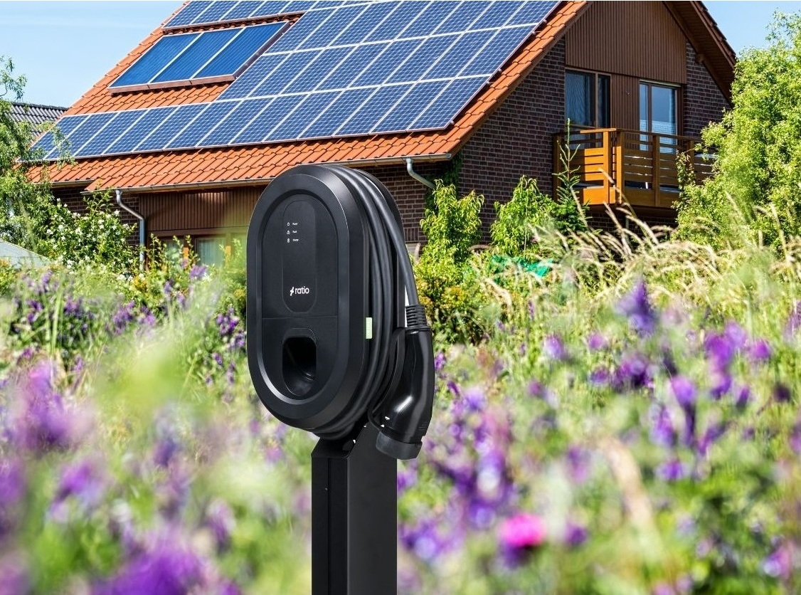 Ratio Solar charger in the front of a house with solar panels